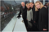 Following the swearing-in ceremony at the U.S. Capitol, Vice President Dick Cheney watches the Presidential Inaugural Parade with his wife, Lynne, left, and daughters Mary, center, and Liz January 20, 2001.