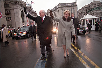 Vice President Dick Cheney and his wife, Lynne, wave to the crowds of people lining Pennsylvania Avenue as they participate in the Presidential Inaugural Parade January 20, 2001.
