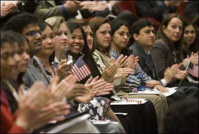 Arlene Oftedahl of Burke, Va., center, is all smiles as she and some of America’s newest citizens applaud Mrs. Cheney as she delivers her remarks during a special naturalization ceremony at the National Archives Tuesday, April 17, 2007, in Washington, D.C. White House photo by Lynden Steele
