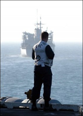The Arabian Gulf (Mar. 15, 2003) -- A Chief Engineman stands on the flight deck of the aircraft carrier USS Abraham Lincoln (CVN 72) as he awaits the fast combat support ship USS Camden (AOE 2) to pull along side for an Underway Replenishment (UNREP).U.S. Navy photo by Photographer's Mate 3rd Class Philip A. McDaniel 