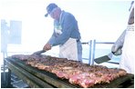 The Pacific Ocean (Apr. 28, 2003) -- Volunteers from Harris Ranch Steakhouse barbecue steaks on the fantail for the crew to show their support for the USS Abraham Lincoln’s (CVN 72) participation in Operation Iraqi Freedom. The volunteers used their own money to buy the steaks for over 5000 crewmembers aboard Lincoln. U.S. Navy photo by Airman Geanine I. Ortez