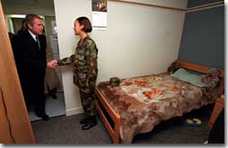 President George W. Bush visits a soldier in her barracks at Ft. Stewart, Georgia on February 12, 2001. President Bush visited several military bases last week to reaffirm his commitment to improve living conditions for the people who serve in America's armed forces. (WHITE HOUSE PHOTO BY PAUL MORSE)