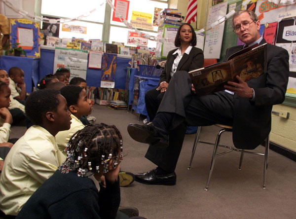 President George W. Bush reads to students at J.C. Nalle Elementary School in Washington, D.C. on February 9, 2001