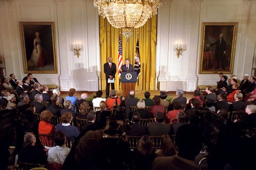 President George W. Bush and Rod Paige, who has been chosen to be the Secretary of Education, unveil the administration's education plan in the East Room Jan. 23, 2001. "Both parties have been talking about education reform for quite a while," said the President. "It's time to come together to get it done so that we can truthfully say in America, 'No child will be left behind -- not one single child.' We share a moment of exceptional promise -- a new administration, a newly sworn-in Congress, and we have a chance to think anew and act anew." White House photo by Hyungwon Kang.