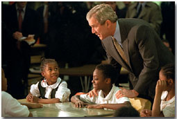 President George W. Bush talks with students at Merritt Elementary School Jan. 25, 2001.