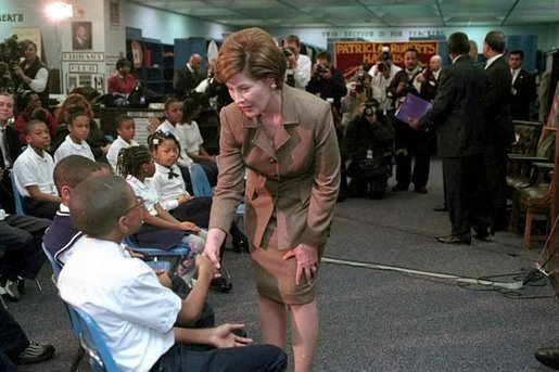 Laura Bush greets children after speaking at the D.C. Teaching Fellows Launch at the Patricia Roberts Harris Educational Center in Washington, D.C., Feb., 22, 2001. White House photo by Carol T. Powers.