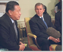 President Bush listens to Prime Minister Yoshiro Mori during a meeting in the Oval Office.