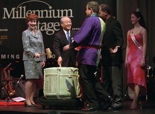 Laura Bush shares the Millennium Stage at the Kennedy Center with Japan’s ambassador Shunji Yanai and Washington, D.C. Mayor Anthony Williams and others during the 2001 Cherry Blossom Festival in Washington, D.C. March 25, 2001. White House photo by Paul Morse.