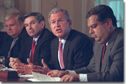 President George W. Bush speaks to reporters during an Energy Meeting in Cabinet Room Thursday, May 3, flanked by Energy Secretary Spencer Abraham, right, and Deputy Defense Secretary Paul Wolfowitz WHITE HOUSE PHOTO BY ERIC DRAPER