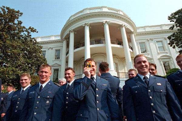 Members of the Air Force Academy football team take a picture of President Bush after he gave the team the Commander In Chief Trophy Friday morning at the White House. WHITE HOUSE PHOTO BY ERIC DRAPER