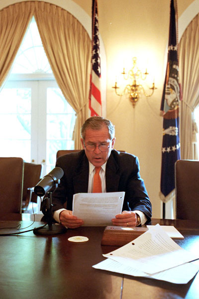 President George W. Bush records the weekly radio address for Cinco de Mayo in the Cabinet Room. This is the first time that a president has recorded the radio address in Spanish and in English. WHITE HOUSE PHOTO BY ERIC DRAPER
