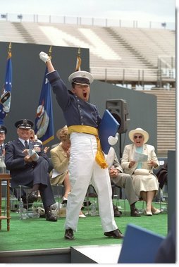 An exultant Air Force Academy graduate celebrates upon receiving his diploma during the U.S. Air Force Academy Commencement ceremonies at Falcon Stadium in Colorado Springs, CO May 30, 2001.  White House photo by David Bohrer