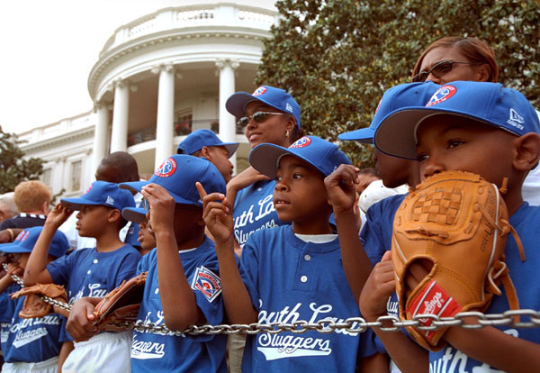 The Memphis Red Sox, of the Satchel Paige Little League in Washington, D.C., watch as the President arrives. WHITE HOUSE PHOTO BY ERIC DRAPER