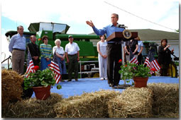 President Bush returned to Tom and Judy Barrett's farm in Dallas City, Iowa, to celebrate the tax cut Friday, June 8.