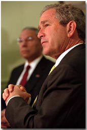 President George W. Bush with Secretary of State Colin
 Powell at a photo opp on Monday June 18, 2001 in the Oval
 Office. White House Photo by Susan Sterner.