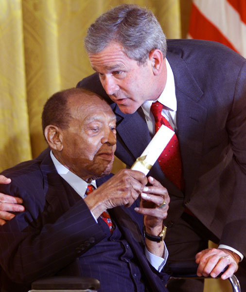 President George W. Bush honors music legend Lionel Hampton during a ceremony recognizing Black Music Month in the East Room of the White House on June 30, 2001. WHITE HOUSE PHOTO BY PAUL MORSE