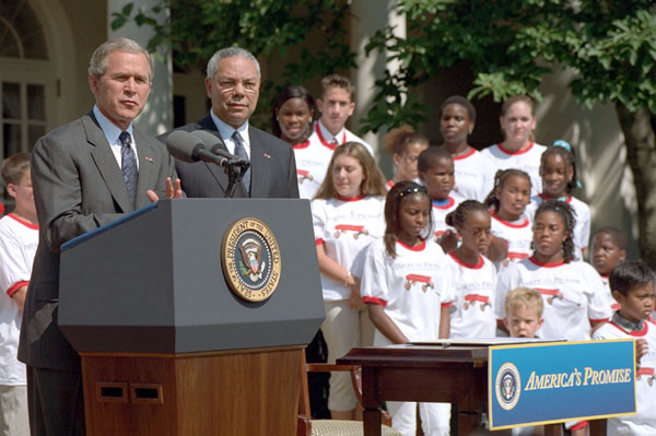 President Bush and Secretary of State Colin Powell hold a press conference about Powell's organization, America's Promise, in the Rose Garden July 9, 2001. White House photo by Moreen Ishikawa.