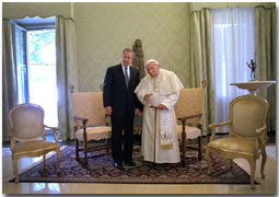 After attending the G-8 Summit in Genoa, President Bush traveled to Rome to meet His Holiness Pope John Paul II July 23, 2001. In addition to posing for photos, the two leaders took a short walk together and talked privately. White House photo by Eric Draper.