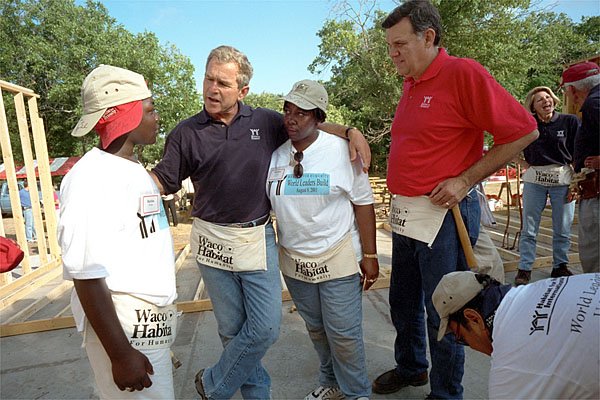 President Bush and Secretary for Housing and Urban Development Martinez, far right, talk with new friends during a break from their house-building efforts at the Waco, Texas, location of Habitat for Humanity's "World Leaders Build" construction drive August 8, 2001. White House photo by Eric Draper.