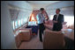 President George W. Bush confers with White House Chief of Staff Andrew Card aboard Air Force One Sept. 11, 2001. White House photo by Eric Draper