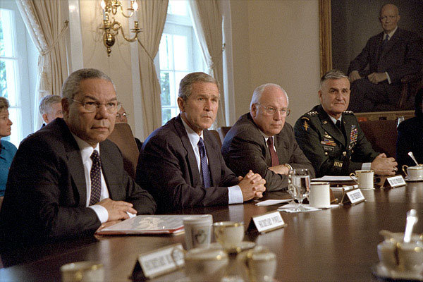 Accompanied by Secretary of State Colin Powell, far left, Vice President Dick Cheney and Chairman of the Joint Chiefs of Staff Hugh Shelton (far right), President George W. Bush talks with the press about the previous day's terrorist attacks during a cabinet meeting Sept. 12, 2001. White House photo by Tina Hager.