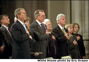 Attending service for the National Day of Prayer and Remembrance for the victims of the terrorist attacks on Sept. 11, President Bush pledges allegiance with Mrs. Laura Bush and his parents, former President George H. and Barbara Bush at the National Cathedral Sept. 14. Former Presidents Clinton (pictured), Carter and Ford also attended. White House photo by Eric Draper.