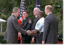 Inviting several charitable organizations to the White House Rose Garden, President Bush thanks representatives from the groups that helped with the relief effort at the World Trade Center and the Pentagon. "Last week was a really horrible week for America. But out of our tears and sadness, we saw the best of America as well. We saw a great country rise up to help," said the President in his remarks. More than 55 million dollars has been raised in one week. White House photo by Paul Morse.