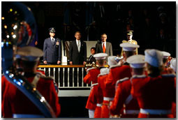 With Secretary of Defense Donald Rumsfeld at his side, President George W. Bush presides over the welcoming ceremony for the incoming Chairman, Gen. Richard B Myers (left), and Vice-Chairman, Gen. Pete Pace (right), of the Joint Chief of Staffs at Fort Meyers Oct. 15. White House photo by Tina Hager.