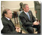 President George W. Bush and Algerian President Abdelaziz Bouteflika talk with the media in the Oval Office Nov. 5. White House photo by Eric Draper.