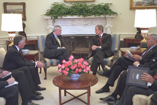 President George W. Bush talks with Prime Minister Bertie Ahern of Ireland in the Oval Office Nov. 8. White House photo by Tina Hager.