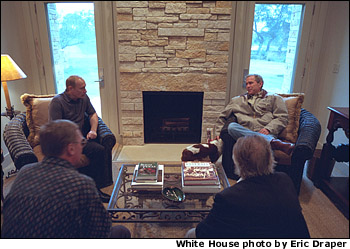 President George W. Bush and Russian President Vladimir Putin begin their first meeting at the Bush Ranch in Crawford, Texas, Wednesday, Nov. 14, 2001. Also pictured at bottom are Russian and American interpreters. White House photo by Eric Draper.