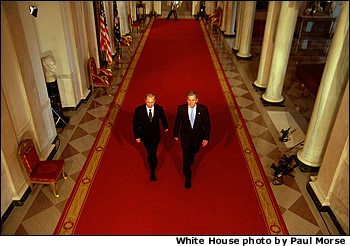 President George W. Bush and Russian President Vladimir Putin walk out to address the media at the White House Nov. 13. "This is a new day in the long history of Russian-American relations, a day of progress and a day of hope," said President Bush in his remarks. White House photo by Paul Morse.