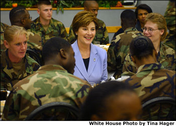 <a href="/news/releases/2001/11/20011121-3.html">Laura Bush</a> talks with members of the 101st Airborne at Fort Campbell, Kentucky. Known as "The Screaming Eagles," this airborne division took part in the largest airborne assault of World War II and also served in Vietnam and more recently in the Balkans. White House photo by Tina Hager.