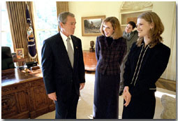 President George W. Bush talks with Dayna Curry, center, and Heather Mercer in the Oval Office Nov. 26. The two humanitarian workers recently returned to the United States after being held captive by the Taliban regime for three months. "Heather Mercer and Dayna Curry decided to go to help people who needed help," said the President in his remarks to the media. "Their faith led them to Afghanistan. One woman who knows them best put it this way: they had a calling to serve the poorest of the poor, and Afghanistan is where that calling took them.". White House photo by Eric Draper.