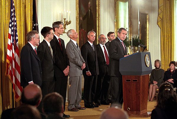 "Standing with me are seven of those who have been selected this year," said President George W. Bush during a ceremony honoring the U. S. Nobel Laureates in the East Room Nov. 27. "Among their achievements are path-breaking discoveries in physics, helpful insights in the workings of the market economies, and a new treatment for Parkinson's Disease." White House photo by Tina Hager.