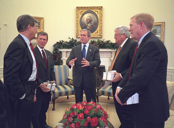 President George W. Bush meets with Congressional leaders Trent Lott, Tom Daschle, Dennis Hastert and Richard Gephardt in the Oval Office Tuesday morning, December 18. (Each received a wrapped White House Christmas ornament from the President, which they are holding.) White House photo by Eric Draper.