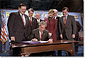 President George W. Bush signs the Small Business Liability Relief and Brownfields Revitalization Act in Conshohocken, Pennsylvania, Jan. 11. Standing left to right and Rep. Paul Gillmor of Ohio, Rep. Robert Borski of Penn., State Attorney General Mike Fisher, EPA Administrator Christie Todd Whitman, Rep. Joseph Hoeffel of Penn. and Pennsylvania Governor Mark Schweiker. White House photo by Eric Draper.