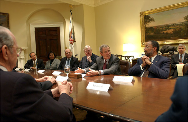President George W. Bush meets with the President's Commission to Strengthen Social Security in the Roosevelt Room Jan. 18, 2002. Seated with the President are, from left to right, William Frenzel (far left), Mario Rodriguez, Gwendolyn King, Dr. John Cogan, Commission Co-chair Sen. Daniel Patrick Moynihan, Co-chair Richard D. Parsons and Deputy Chief of Staff Josh Bolten. White House photo by Eric Draper.