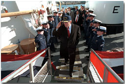 President Bush salutes as he disembarks the ship after his tour Jan. 25. "When it comes to securing our homeland, and helping people along the coast, the Coast Guard has got a vital and significant mission," said the President in his remarks at nearby Southern Maine Technical College. "And, therefore, the budget that I send to the United States Congress will have the largest increase in spending for the Coast Guard in our nation's history." White House photo by Eric Draper.