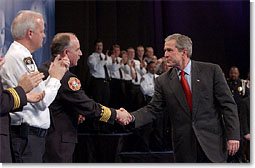President George W. Bush greets local law enforcement officers after remarks on Citizen Preparedness at Lawrence Joel Veterans Memorial Coliseum in Winston-Salem, N.C. Wednesday, Jan 30, 2002. White House Photo by Eric Draper.