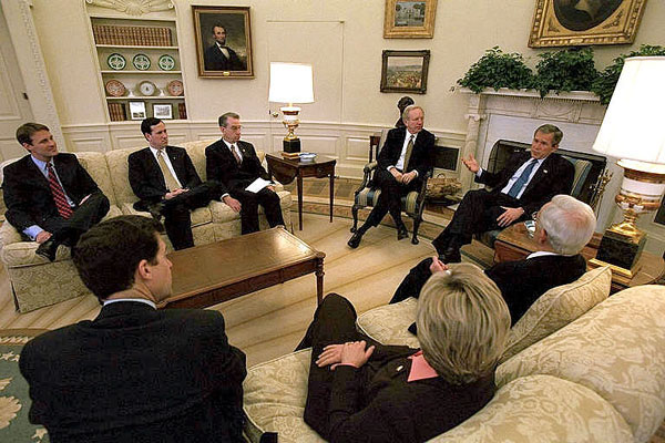 President George W. Bush and Sen. Joseph Leiberman join other visiting Senators in the Oval Office to discuss Armies of Compassion, a faith-based initiative from the United States Senate. "This legislation will not only provide a way for government to encourage faith-based programs to exist without breaching the separation of church and state, it will also encourage charitable giving as well," explained President Bush. White House photo by Tina Hager.