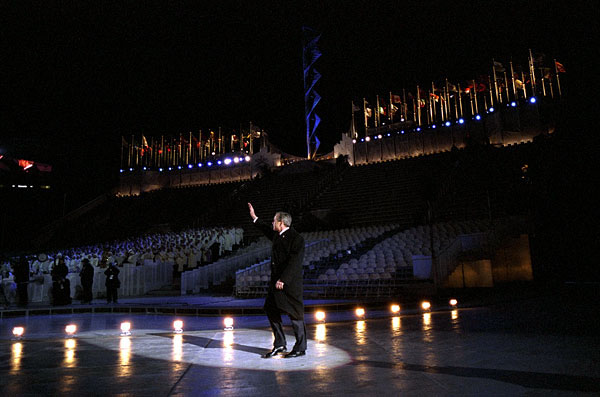 President George W. Bush waves to the crowd as he walks across the ice during the opening ceremonies for the 2002 Winter Olympic Games in Salt Lake City, Utah, Feb. 8. White House photo by Eric Draper.