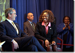 President George W. Bush and Frances Cunningham address the Chamber of Commerce in Charlotte, N.C., Feb. 27. The President discussed Welfare Reform and Job Training. Ms. Cunningham, who is a single mother who worked her way off welfare, introduced the President. White House photo by Paul Morse.