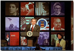 President George W. Bush addresses the 2002 National Summit on Retirement Savings Feb. 28. "Government must support policies that promote and protect saving," said the President. "And saving is the path to independence for Americans in all phases of life, and we must encourage more Americans to take that path." White House photo by Paul Morse.