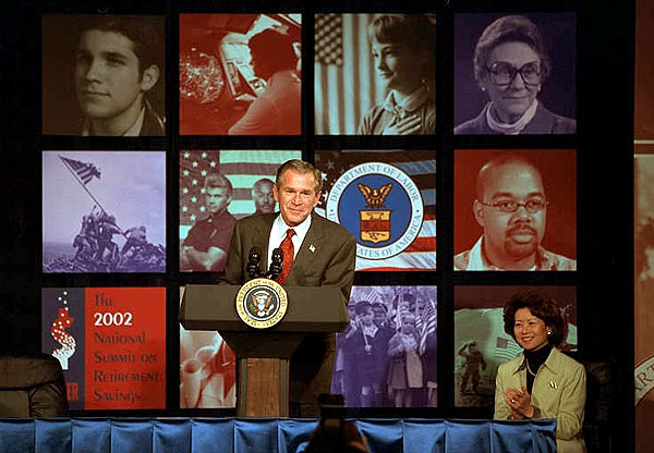 President George W. Bush addresses the 2002 National Summit on Retirement Savings Feb. 28. "Government must support policies that promote and protect saving," said the President. "And saving is the path to independence for Americans in all phases of life, and we must encourage more Americans to take that path." White House photo by Paul Morse.