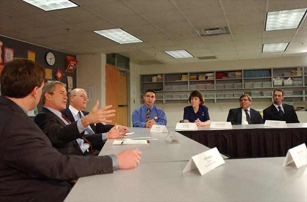 Before addressing the assembled audience and media, President George W. Bush holds a roundtable discussion with educators and students at Eden Prairie High School March 4. Pictured from left to right are Jeff Ireland, Principal of Eden Prairie; Mark Yudof, President of the University of Minnesota; Jesse Tejeda, student at the U of Minn.; Cathy Bockenstedt, science teacher at Central Middle School; Steve Cwodzinski, teacher at Eden Prairie; and Jesse Josephson, teacher at Forest Hills Elementary School. White House photo by Eric Draper.
