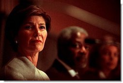 Laura Bush pauses during her remarks on the plight of Afghani women to the United Nations International Women's Day Conference "Afghan Women Today: Realities and Opportunities" at the United National Headquarter in New York, March 8, 2002.  White House photo by Susan Sterner