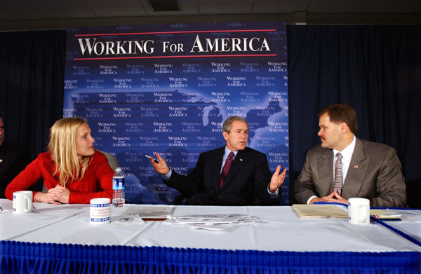 President George W. Bush participates in a roundtable discussion on corporate responsibility at America II Electronics in St. Petersburg, Florida, Friday, March 8, 2002. Also pictured at right, CEO of America II Electronics Michael Galinski, and employee Sarah Wood. White House photo by Eric Draper.