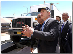 President George W. Bush reviews the Vehicle and Cargo Inspection System during a tour of the cargo dock at the Bridge at the Americas in El Paso, Texas, Thursday, March 21. Also pictured, from left, are Port Operations Director David Longoria, Texas Governor Rick Perry and Congressman Henry Bonilla (R-23rd). 