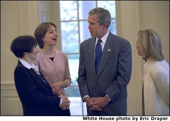 President George W. Bush meets with Sarah Hughes, Olympic gold medalist and figure skater (center, left), her mother, Amy Hughes (far left), and her coach Robin Wagner in the Oval Office Friday, April 12, 2002. White House photo by Eric Draper.